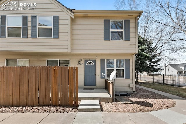 view of front of house with fence