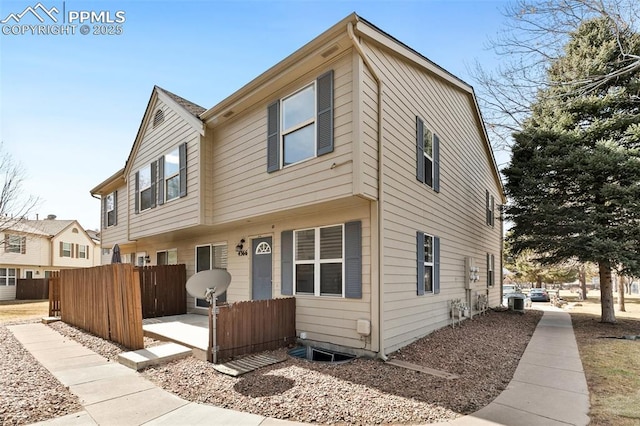 multi unit property featuring central AC unit and fence