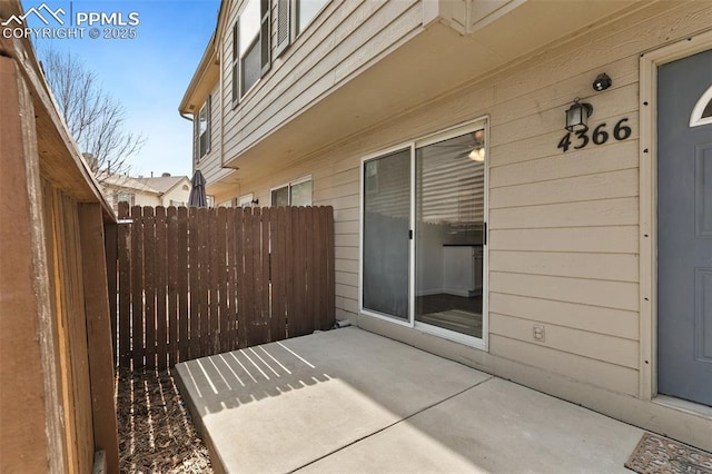 view of patio featuring fence