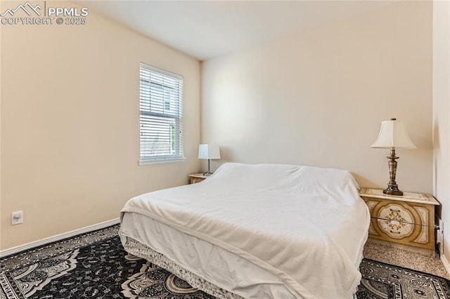 bedroom featuring baseboards