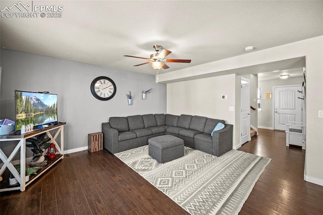 living area with ceiling fan, baseboards, and wood finished floors