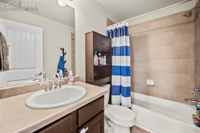 full bath with toilet, a textured wall, shower / bathtub combination with curtain, and vanity