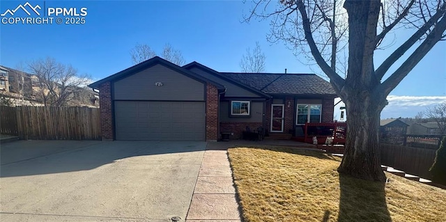 ranch-style house with a garage, concrete driveway, brick siding, and fence