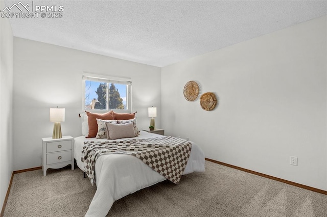 carpeted bedroom with a textured ceiling and baseboards