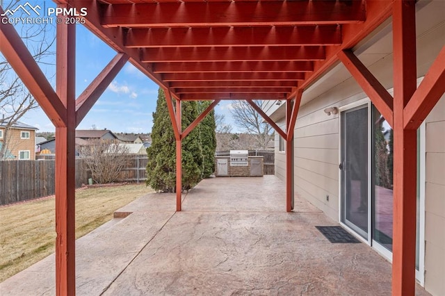 view of patio featuring a fenced backyard and exterior kitchen