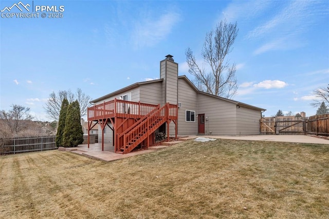 back of property with stairs, a yard, a patio area, and a fenced backyard