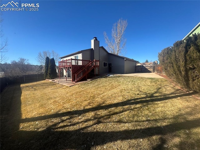 rear view of house featuring stairs, a patio, a fenced backyard, and a wooden deck