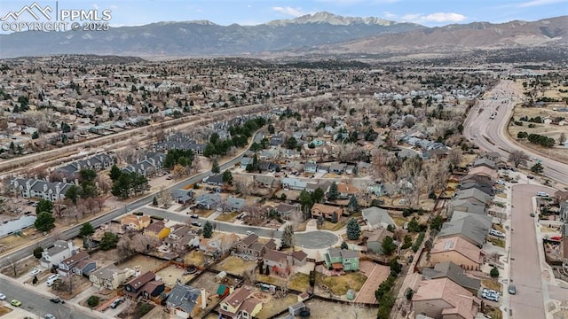 drone / aerial view with a residential view and a mountain view