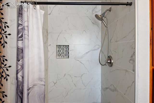 bathroom with a tile shower