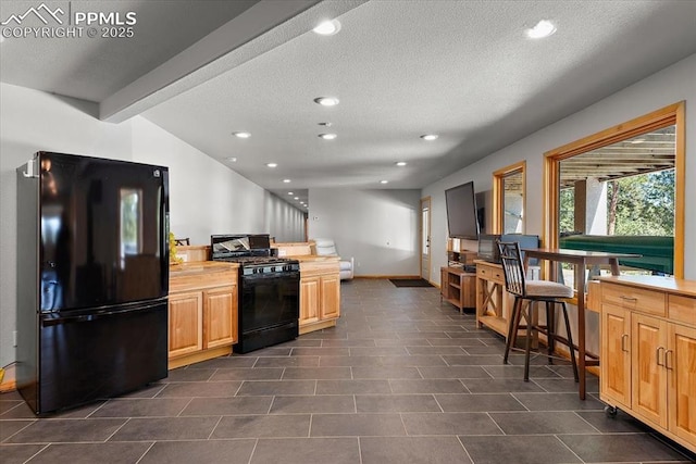 kitchen with vaulted ceiling with beams, recessed lighting, light countertops, a textured ceiling, and black appliances