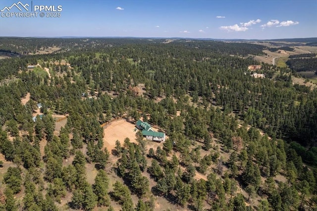 drone / aerial view with a view of trees