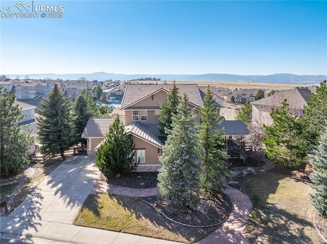 birds eye view of property with a residential view and a mountain view