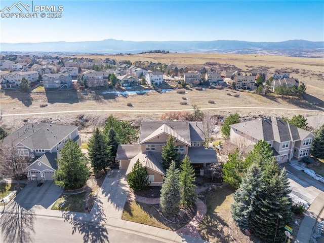 drone / aerial view featuring a mountain view and a residential view