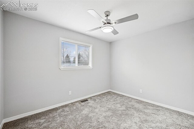 empty room featuring baseboards, carpet, visible vents, and a ceiling fan