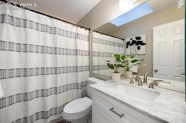 full bath featuring toilet, a skylight, a shower with curtain, and vanity