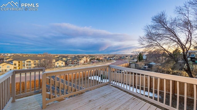 wooden terrace featuring a residential view