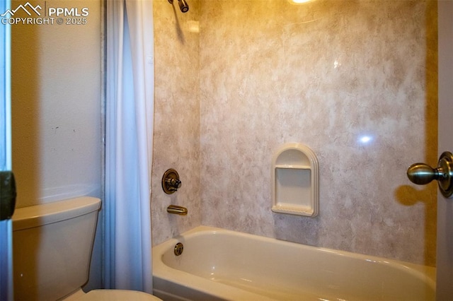 full bathroom featuring shower / bath combo and toilet