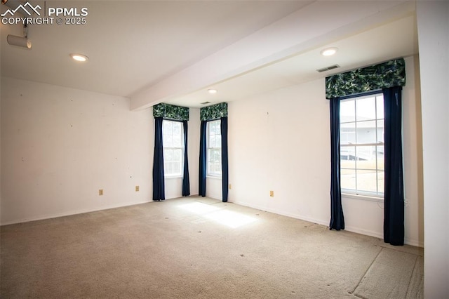 unfurnished room featuring carpet, visible vents, baseboards, and recessed lighting