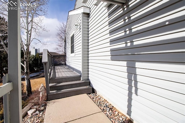 view of side of home with a deck