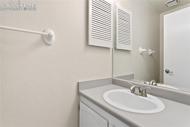 bathroom featuring vanity and visible vents