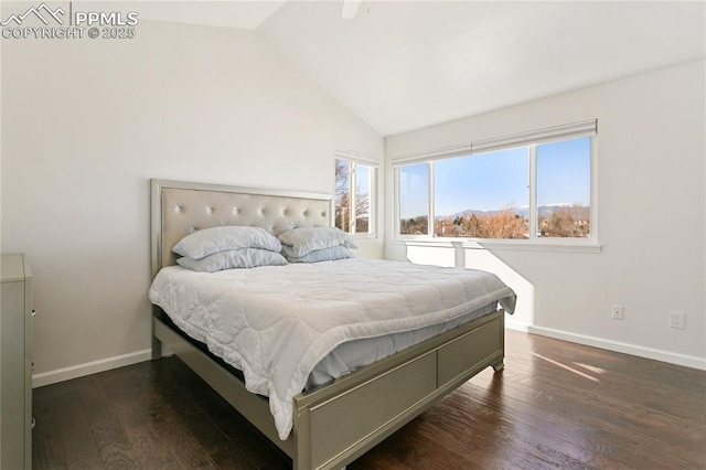 bedroom featuring vaulted ceiling, baseboards, and wood finished floors