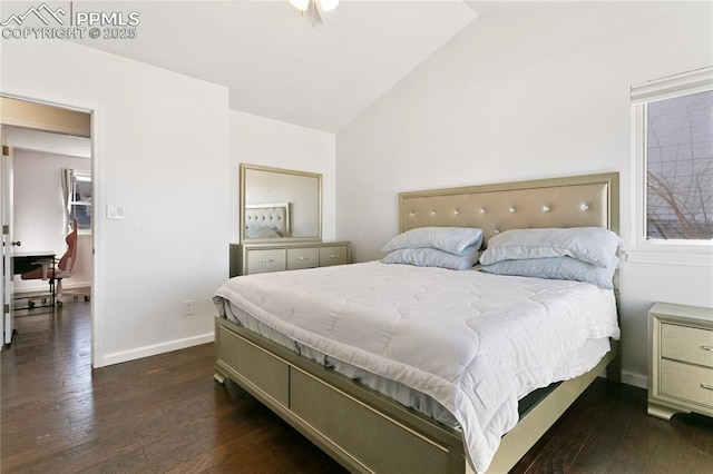 bedroom featuring dark wood finished floors, vaulted ceiling, and baseboards