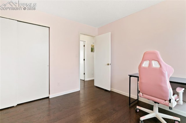 office area featuring baseboards and wood finished floors