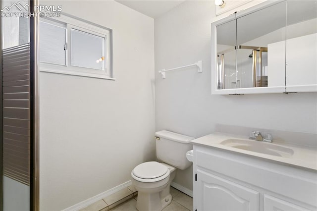 bathroom with tile patterned flooring, toilet, vanity, baseboards, and a shower stall