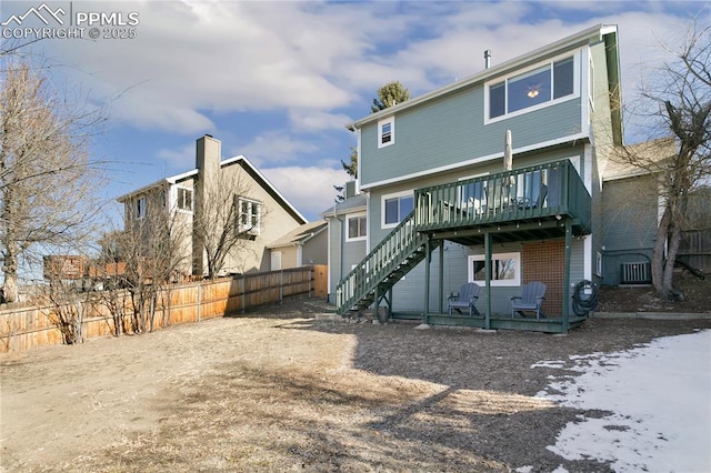 rear view of house featuring central AC, fence, stairway, a wooden deck, and a patio area