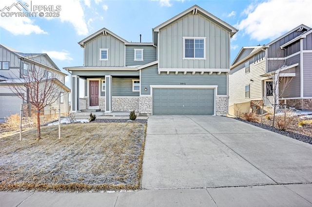 craftsman inspired home with board and batten siding, covered porch, driveway, and an attached garage