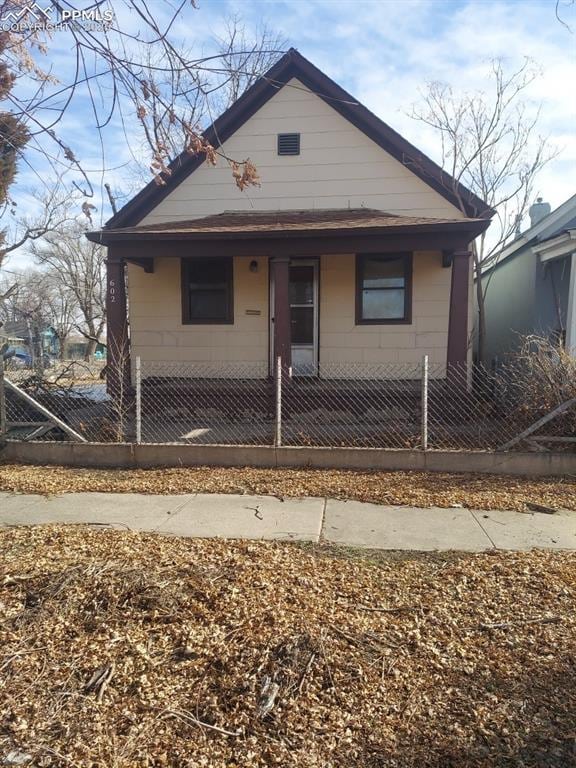 bungalow with a fenced front yard