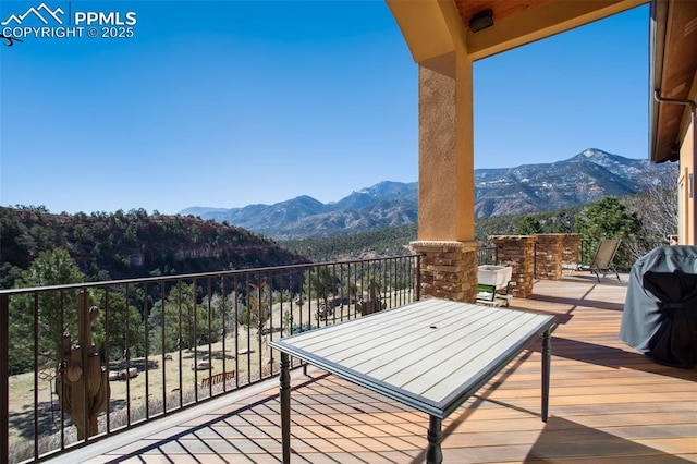 balcony with a grill and a mountain view