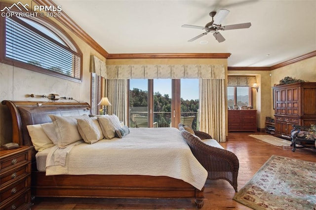 bedroom featuring access to exterior, ornamental molding, and wood finished floors