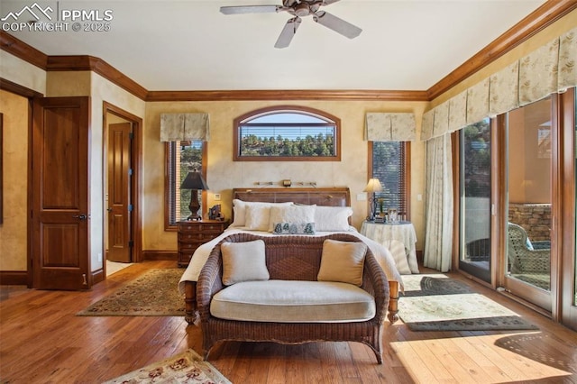 bedroom featuring a ceiling fan, baseboards, access to outside, ornamental molding, and hardwood / wood-style floors