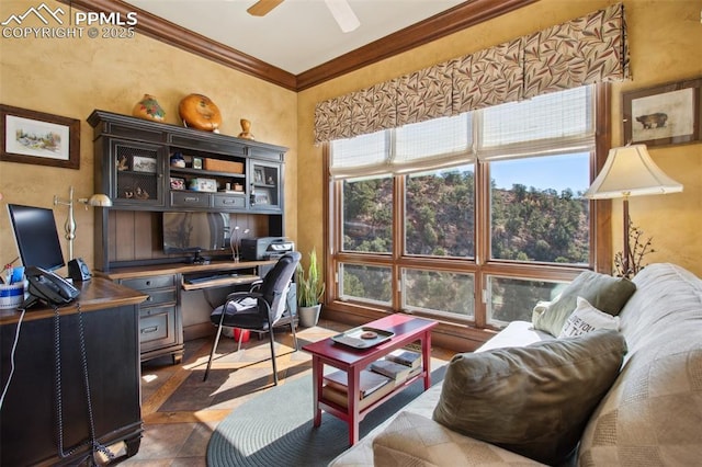 office space featuring ornamental molding and a ceiling fan