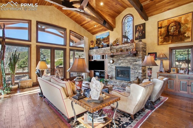 living area with a fireplace, wood-type flooring, high vaulted ceiling, wooden ceiling, and beamed ceiling