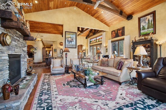 living room featuring wooden ceiling, wood-type flooring, and a stone fireplace