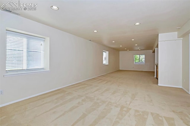 spare room featuring recessed lighting, visible vents, baseboards, and light colored carpet