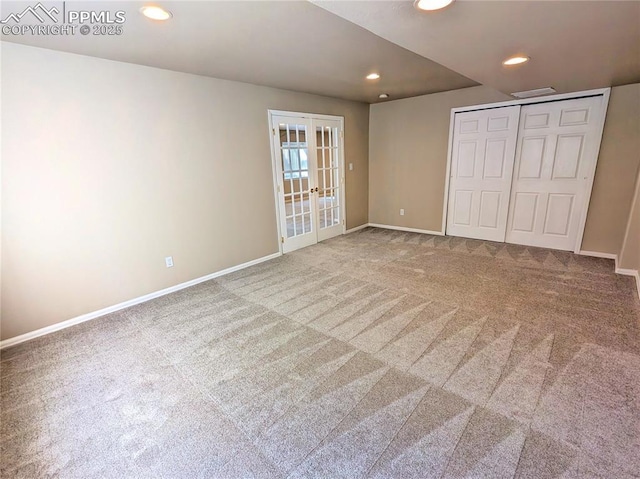 unfurnished bedroom featuring recessed lighting, french doors, carpet floors, a closet, and baseboards