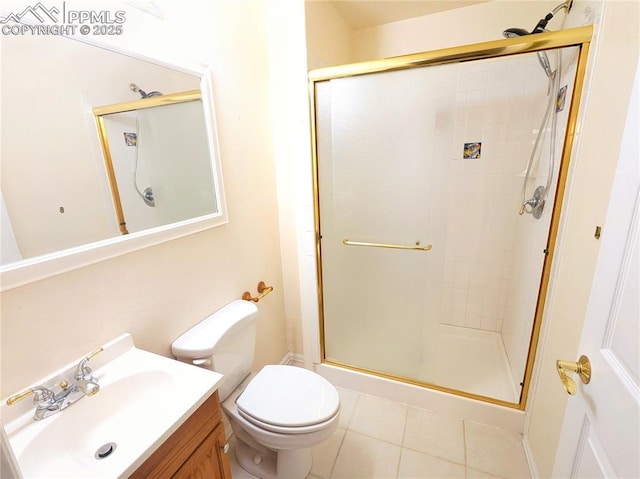 full bath with tile patterned floors, vanity, a shower stall, and toilet