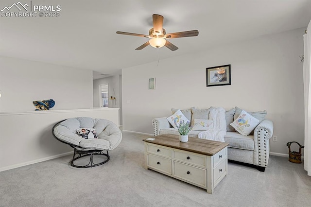 living area featuring baseboards, light carpet, and a ceiling fan