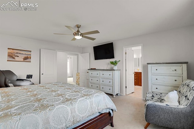 bedroom with light carpet, ensuite bath, and a ceiling fan