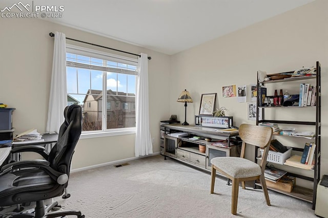 home office with visible vents, baseboards, and carpet flooring