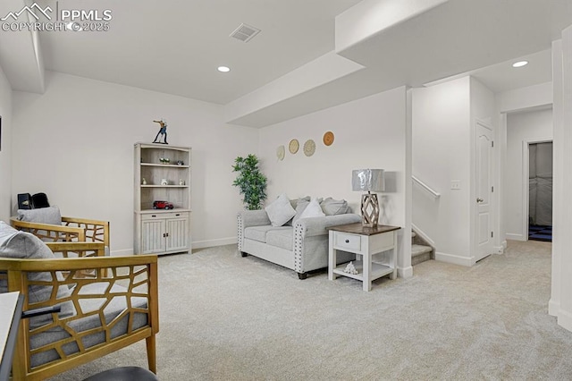 carpeted living area featuring visible vents, recessed lighting, stairway, and baseboards