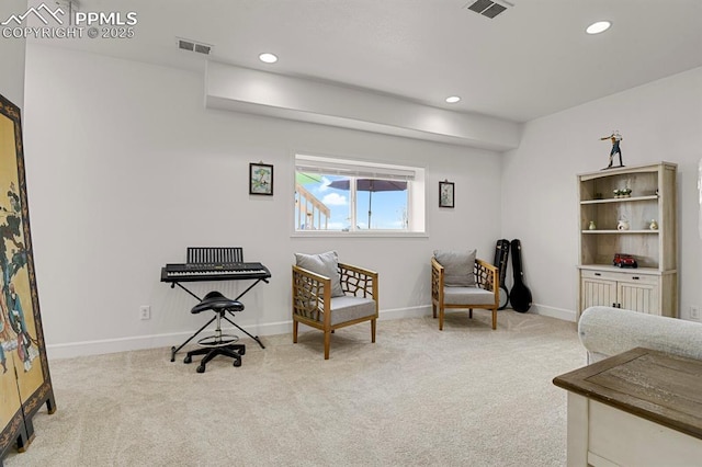 living area featuring recessed lighting, visible vents, and carpet floors