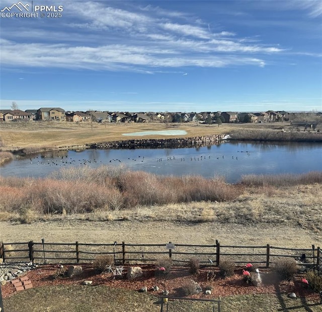 property view of water with fence