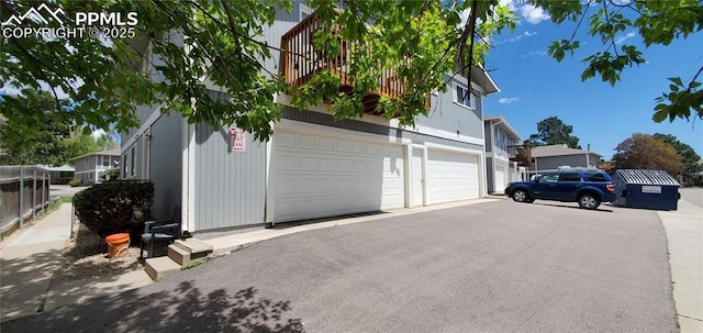 view of side of home featuring a garage