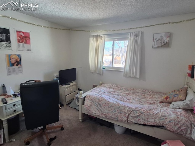 carpeted bedroom featuring a textured ceiling