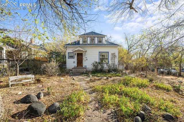 view of front of home featuring fence