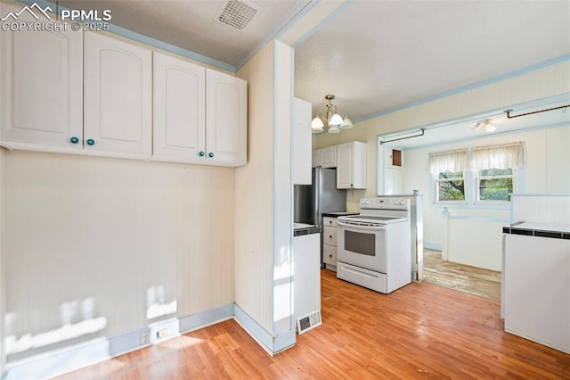 kitchen featuring light wood-style flooring, visible vents, white cabinets, and electric range